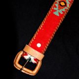 Buckle on a Maya belt in red