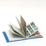 Open book of 24 individually designed postcards featuring an assortment of vintage colour theories